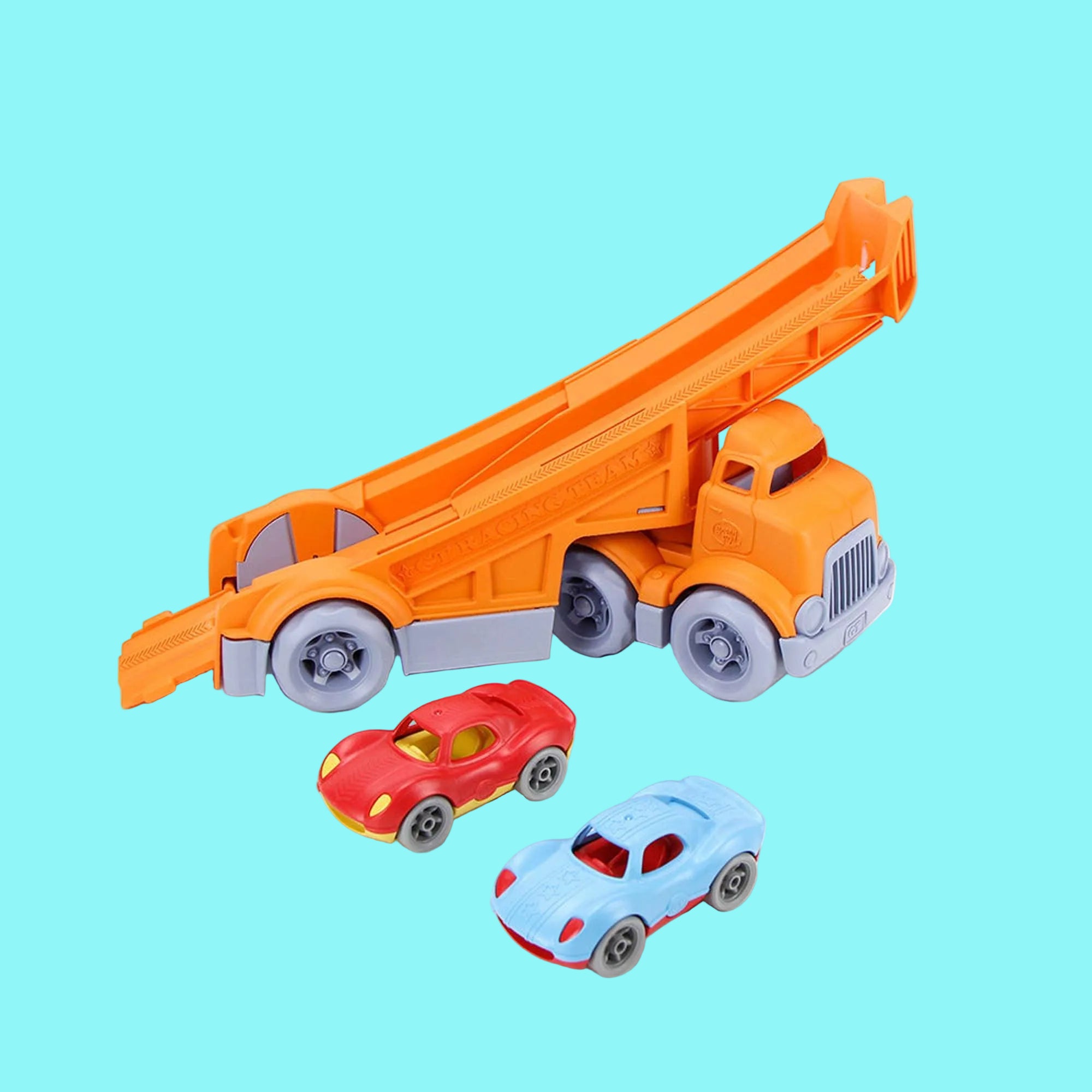 Toy dump truck with two cars on a white background
