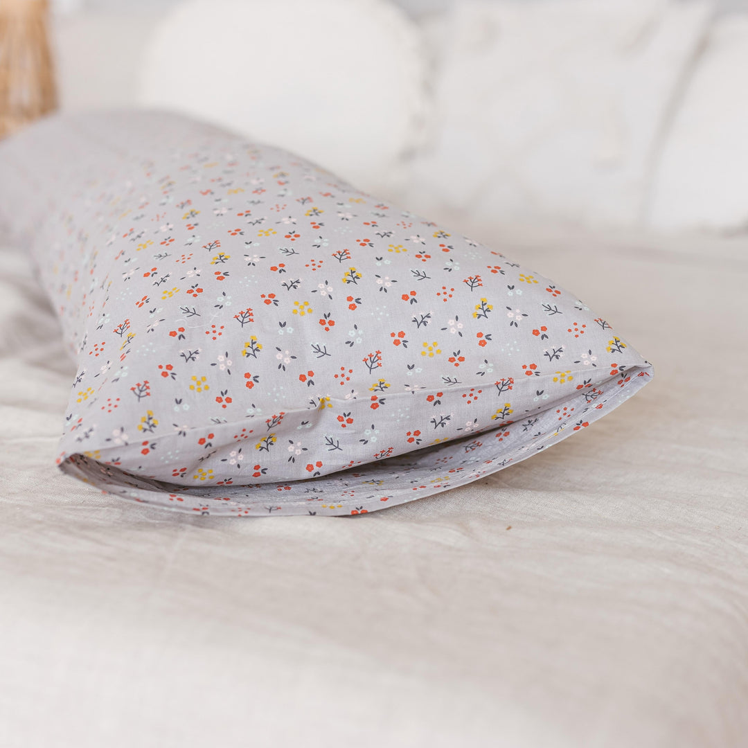 Close up of pregnancy pillow showing delicate floral design