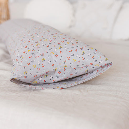 Close up of pregnancy pillow showing delicate floral design