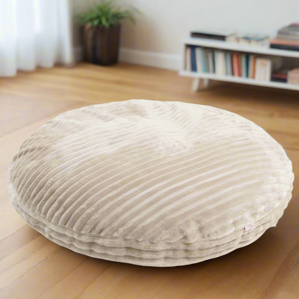 Round beige cushion with ribbed chunky corduroy style texture