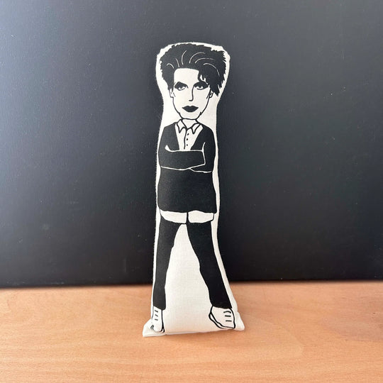 Screen printed black and white doll depicting Robert Smith with his arms crossed