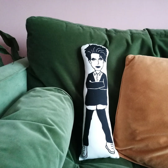 The larger 45cm version of the screen printed doll on a green velvet sofa