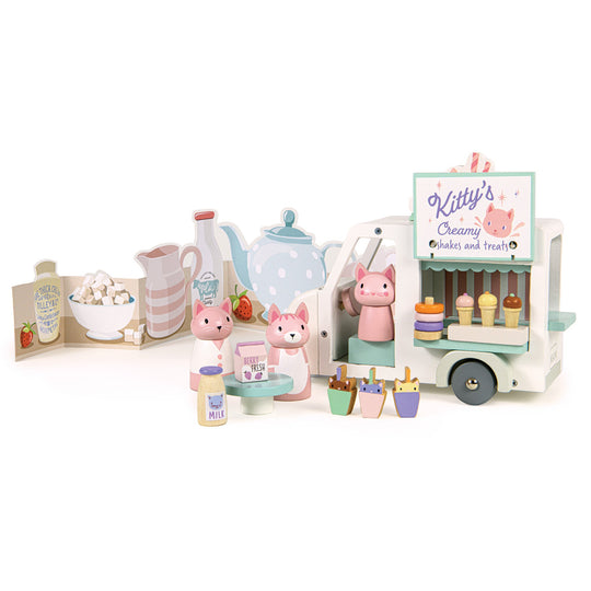 Pastel-coloured toy set with a milkshake truck and character figures on a white background