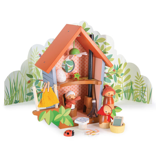 Toy playset with a small bird house, bird characters and accessories on a white background