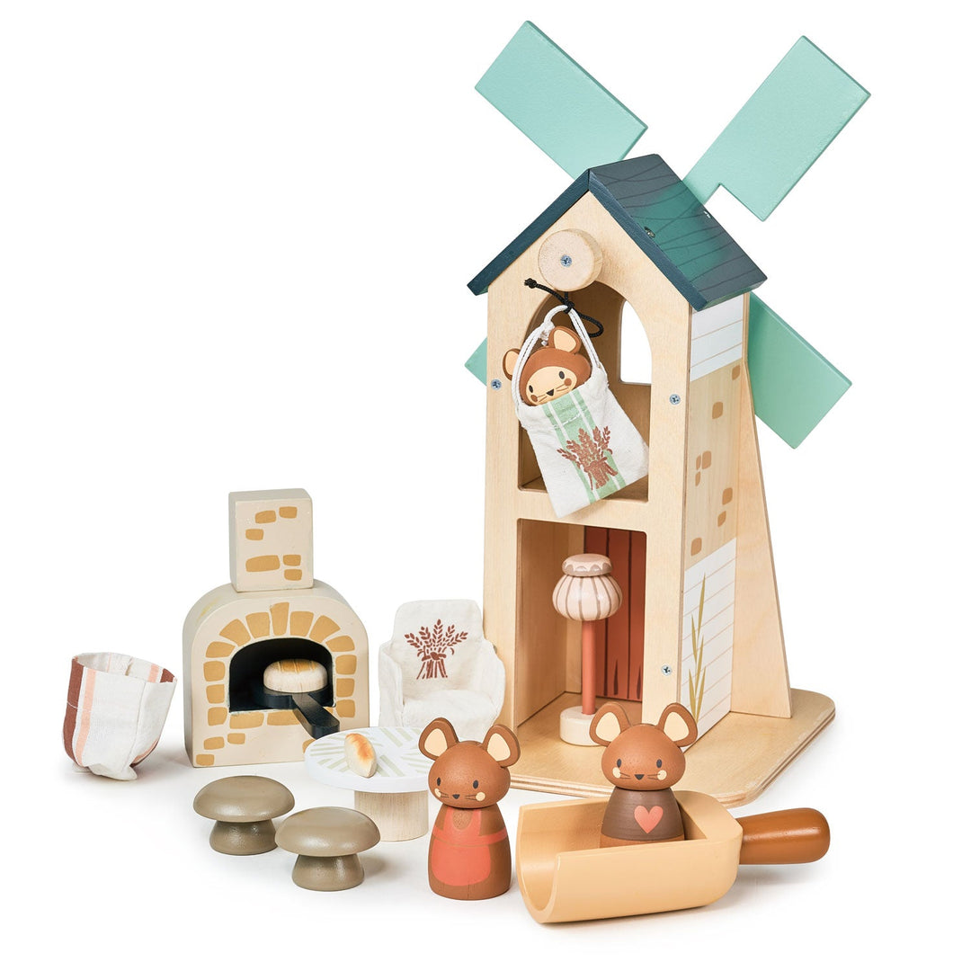 Wooden toy set with a windmill, bread oven, bags of flour and small animals on a white background