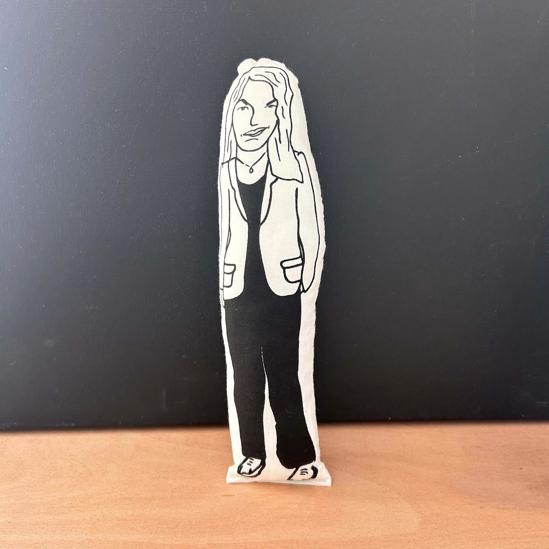 Screen printed black and white doll depictingthe artist Tracey Emin wearing a suit