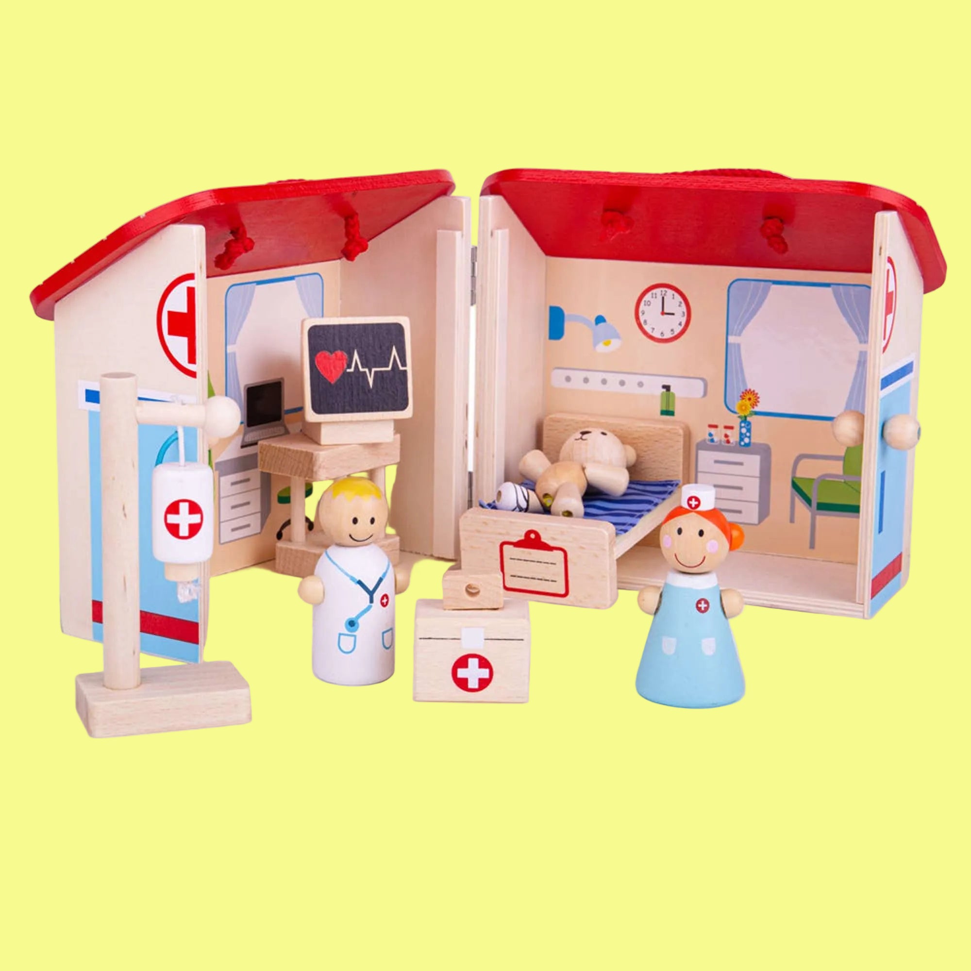 Toy medical clinic set with wooden figures on a white background