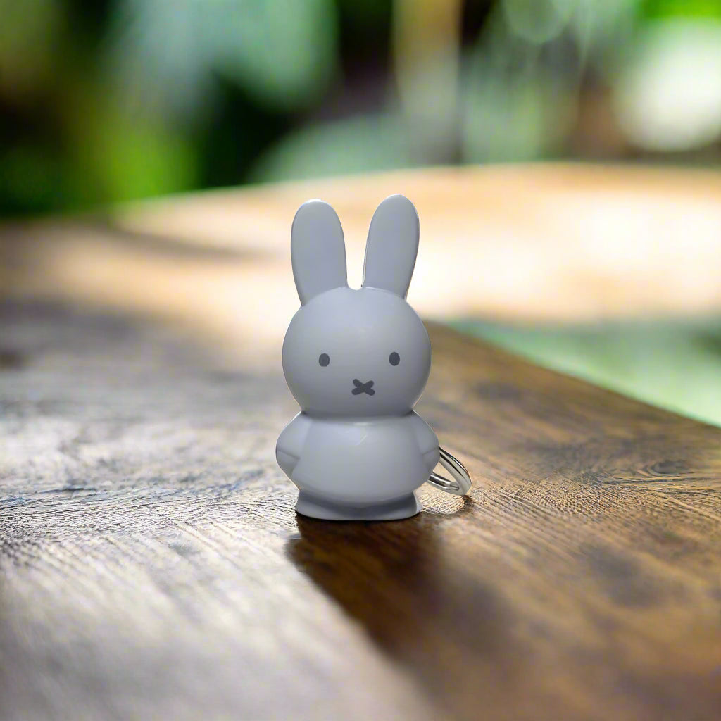 Grey-blue rabbit keyring with iconic cross stitched mouth