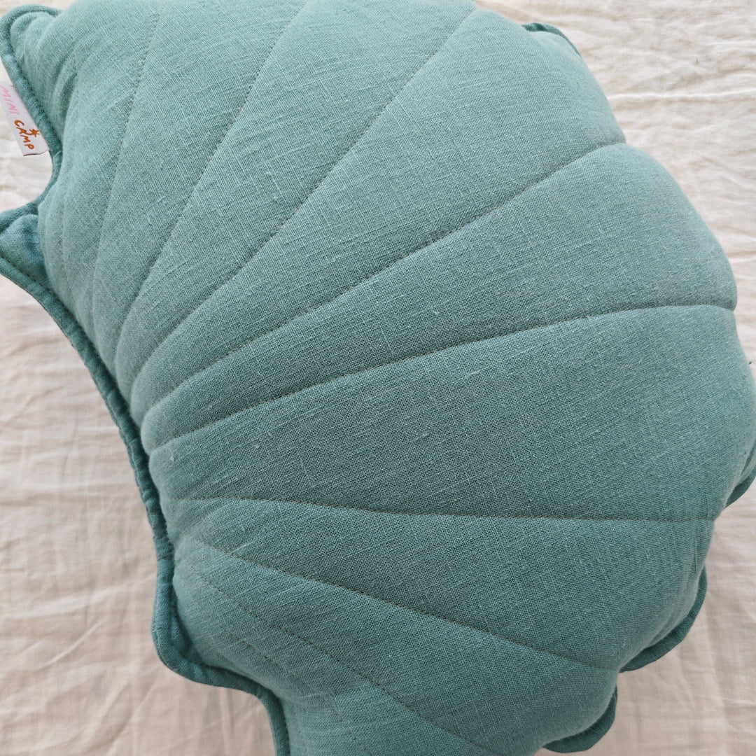Close up of shell shaped cushion showing the seams in the design