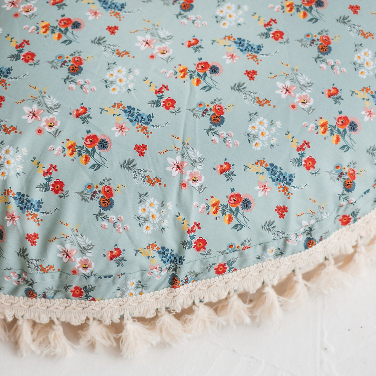 Close up of cushion showing the floral pattern in detail, revealing a more intrinsic design 