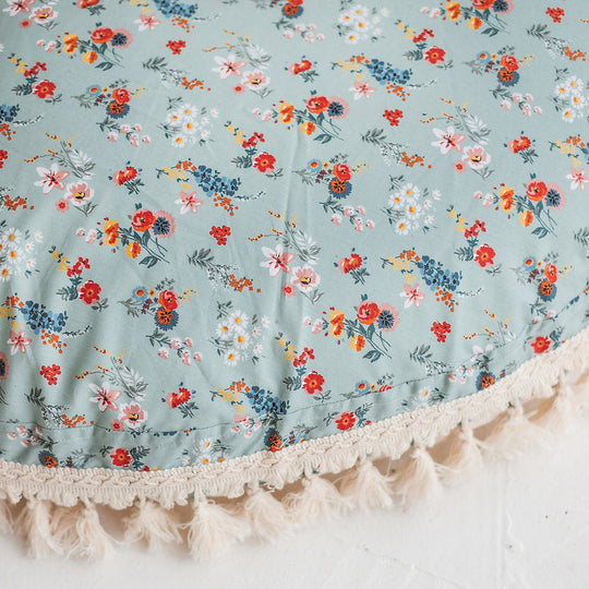Close up of cushion showing the floral pattern in detail, revealing a more intrinsic design 