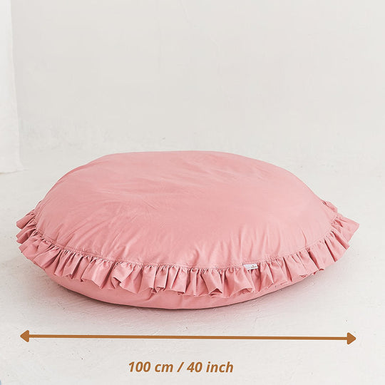 Pink pillow with ruffled edge with diameter measurement of 100cm/40 inches