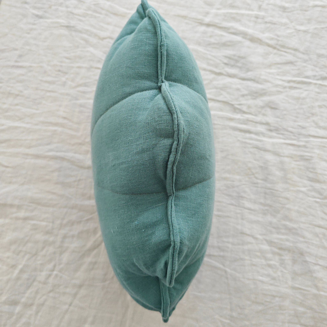 View of the cushion from above showing the rim along the scalloped edge