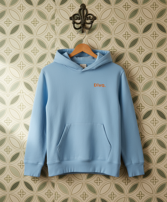 Light blue hoodie with 'Divra' logo on a hanger against a patterned wall.