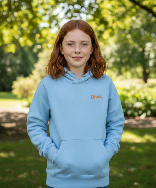 Person wearing a light blue hoodie with 'Diva' logo outdoors
