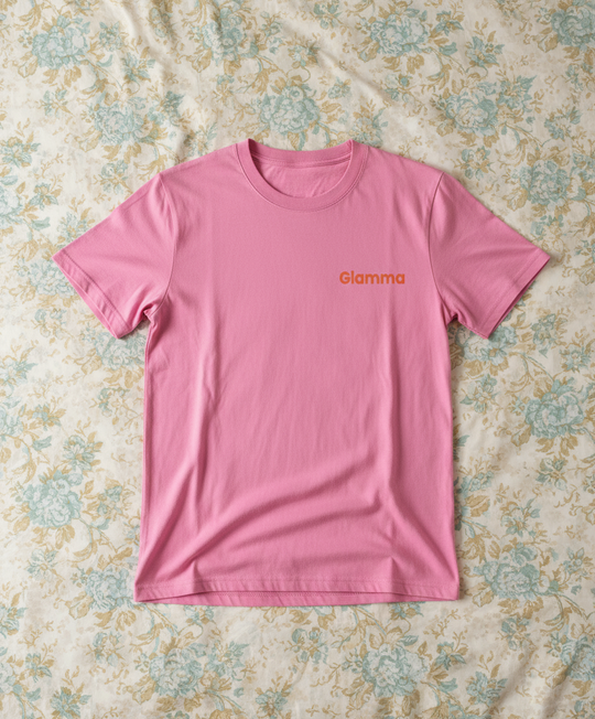 Pink t-shirt with 'Glamma' logo on a floral fabric background