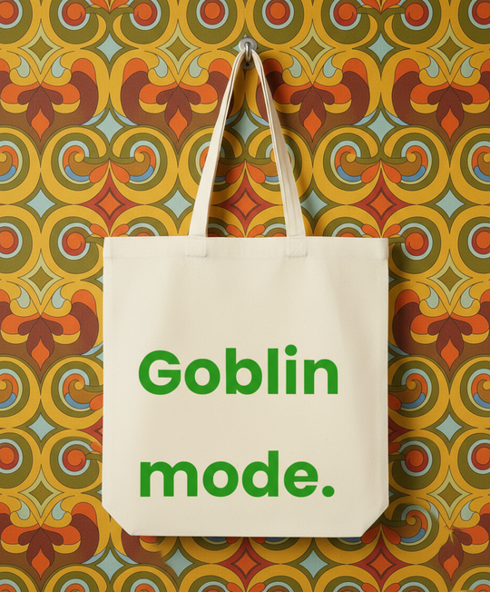 Tote bag with 'Goblin mode.' text on a colorful patterned background