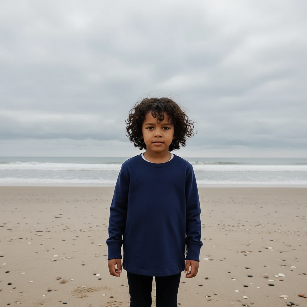 Navy blue long-sleeve shirt on a light blue background