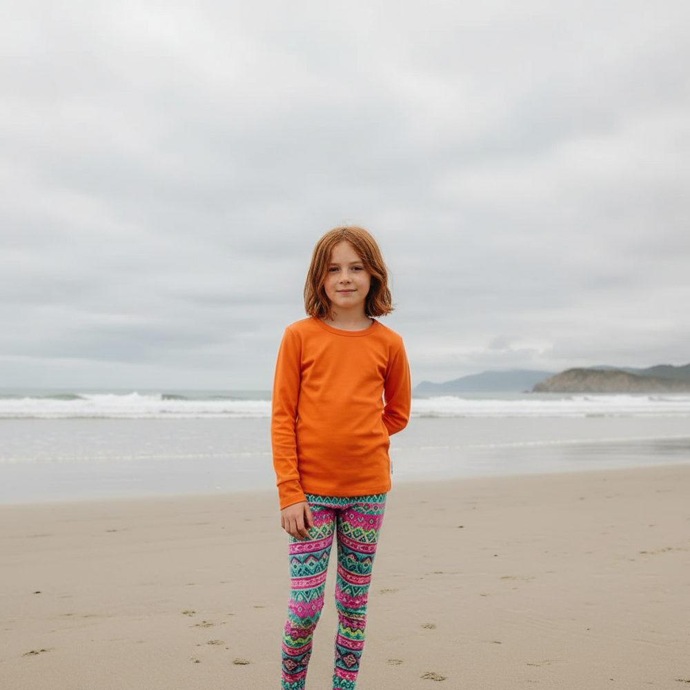 Orange long-sleeve shirt on a matching orange background