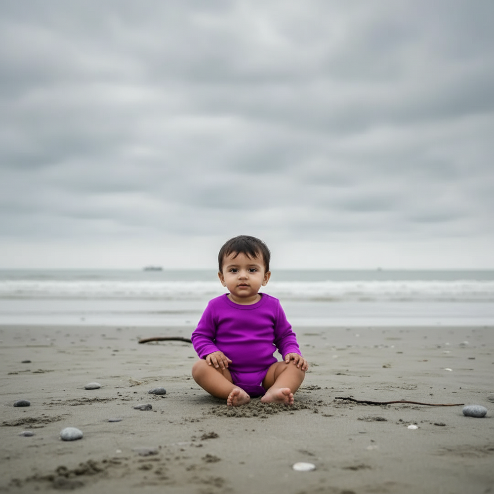 Purple baby bodysuit on a light purple background